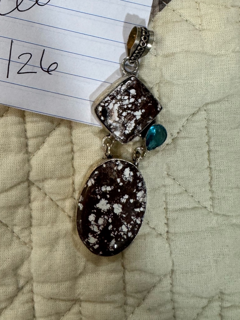 White Buffalo pendant with turquoise stone accent